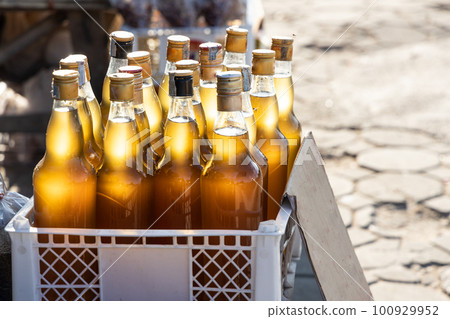 Locally cultivated pure honey sold in stalls along Mae Hong Son and Pai road route in Northern Thailand 100929952