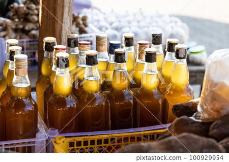 Locally cultivated pure honey sold in stalls along Mae Hong Son and Pai road route in Northern Thailand 100929954
