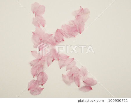 English capital letter "K" drawn with flower petals English capital letter "K" drawn with flower petals 100930721