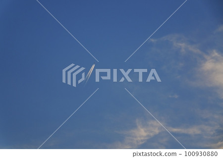 Jet aircraft and contrails illuminated by the morning sun Spring Sky only 230301am 100930880