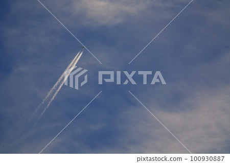 Jet aircraft and contrails illuminated by the morning sun Spring Sky only 230301am 100930887
