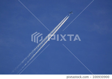 Jet aircraft and contrails illuminated by the morning sun Spring Sky only 230301am 100930900