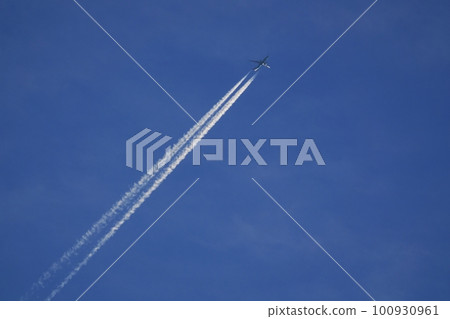Jet aircraft and contrails illuminated by the morning sun Spring Sky only 230301am 100930961