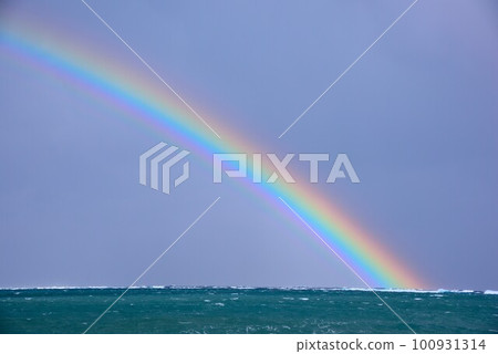 Amami Oshima A vivid rainbow over the stormy sea Amami Oshima A vivid rainbow over the stormy sea 100931314
