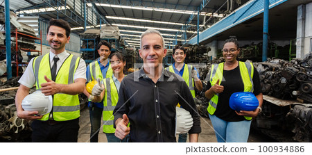 Happy full team engineering worker technician thumb up looking at camera, workshop manufacturing Happy full team engineering worker technician thumb up looking at camera, workshop manufacturing 100934886