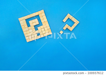 A blue background of a block with a lump of wood cubes and a shape of a letter A blue background of a block with a lump of wood cubes and a shape of a letter 100937612