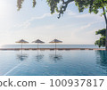 Beach in summer with swimming pool in sunset, beach background. Summer Vacation 100937817