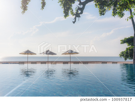 Beach in summer with swimming pool in sunset, beach background. Summer Vacation 100937817