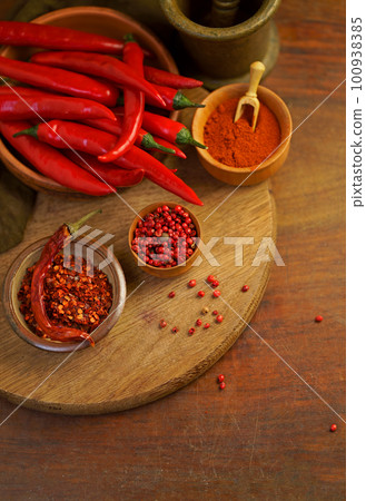 on old wooden table red hot chili peppers on old wooden table red hot chili peppers 100938385