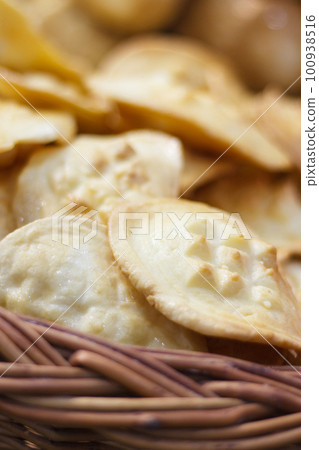 Smoked sheep cheese in wicker basket. Traditional polish local food concept 100938516