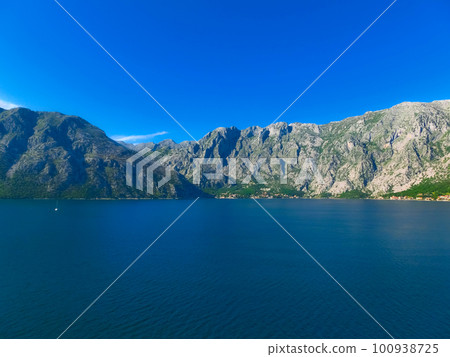 Village on coast of Boka Kotor bay - Montenegro - nature and architecture background Village on coast of Boka Kotor bay - Montenegro - nature and architecture background 100938725