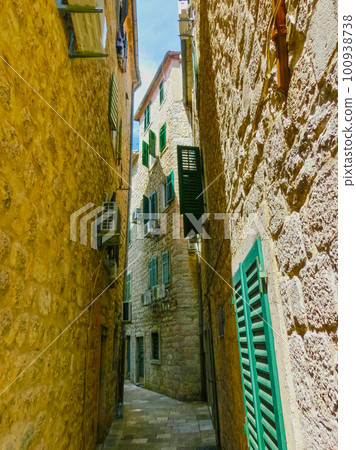 The narrow street in Kotor in a beautiful summer day, Montenegro The narrow street in Kotor in a beautiful summer day, Montenegro 100938738