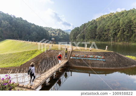 Pang Ung is a tourist attraction in Mae Hong Son, Northern Thailand with scenic alpine lake and pine trees. Thai words translate to Pang Ung Reservoir, Iffigation Work Thailand. Pang Ung is a tourist attraction in Mae Hong Son, Northern Thailand with scenic alpine lake and pine trees. Thai words translate to Pang Ung Reservoir, Iffigation Work Thailand. 100938822