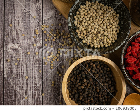The pepper corn and goji berry on wood table for food concept 100939005