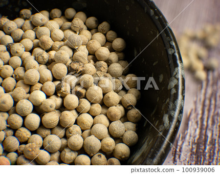 The White paper corn in black bowl on wood Table for food concept The White paper corn in black bowl on wood Table for food concept 100939006
