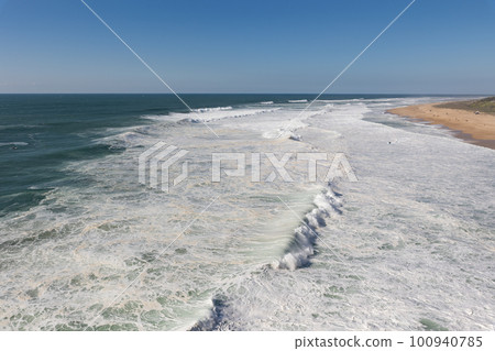 Sea waves cover the seashore 100940785