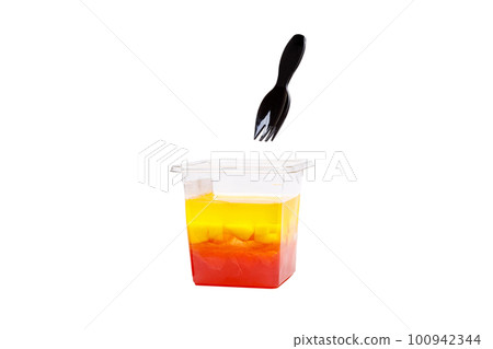 Grapefruit, mango and raspberry jelly in a plastic cup on a white background. Grapefruit, mango and raspberry jelly in a plastic cup on a white background. 100942344