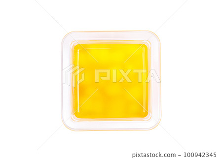 Grapefruit, mango and raspberry jelly in a plastic cup on a white background. View from above. Grapefruit, mango and raspberry jelly in a plastic cup on a white background. View from above. 100942345