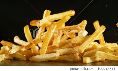 French fries - fried potatoes flying. French fries - fried potatoes flying. 100942741