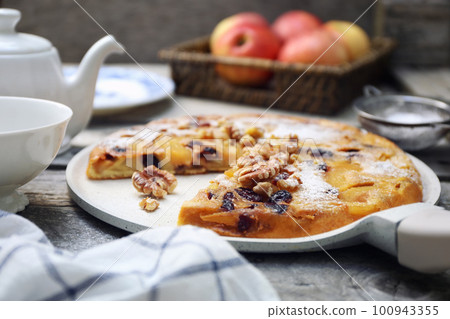 French cuisine. Matefaim. Sweet Apple Pancake with dried cranberries and walnuts for breakfast French cuisine. Matefaim. Sweet Apple Pancake with dried cranberries and walnuts for breakfast 100943355