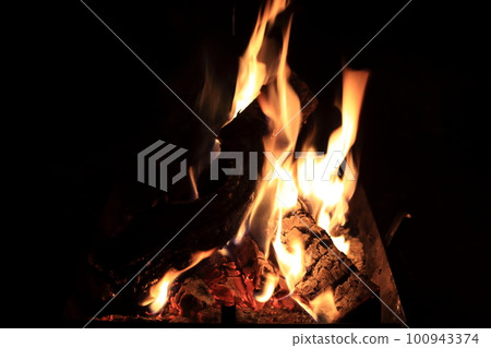 Flames burning in campfire Flames burning in campfire 100943374