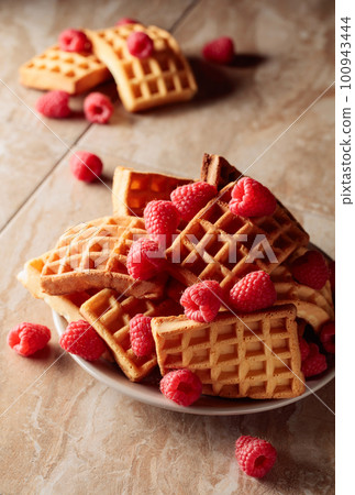 Belgian waffles with raspberries. Belgian waffles with raspberries. 100943444