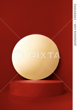 Close up of a round mirror with a golden sheen and an empty red stage for your product. Bright red background. Close up of a round mirror with a golden sheen and an empty red stage for your product. Bright red background. 100945042