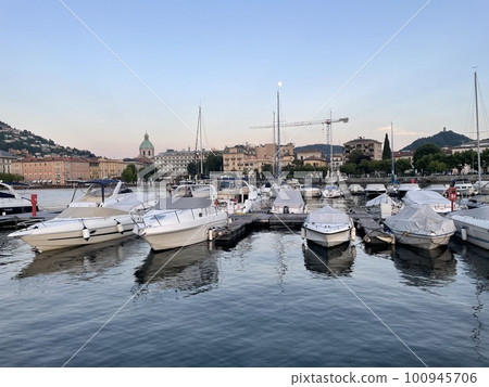 Boats moored in a marina on Lake Como Boats moored in a marina on Lake Como 100945706