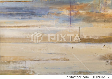 Wooden barn wall with remnants of paint of different colors Wooden barn wall with remnants of paint of different colors 100946467