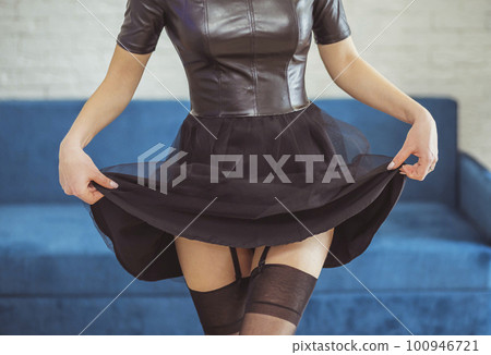 Attractive woman lifted her dress and shows stockings Attractive woman lifted her dress and shows stockings 100946721