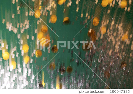 Defocused green and golden holiday bokeh. Abstract christmas background 100947525
