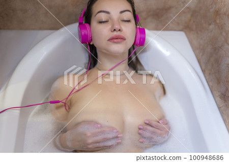 Sexy bathes in the bathroom and listens to music 100948686