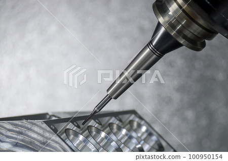 Close up scene the 5-axis machining center cutting the V8 engine cylinder block with solid ball end mill tool. 100950154