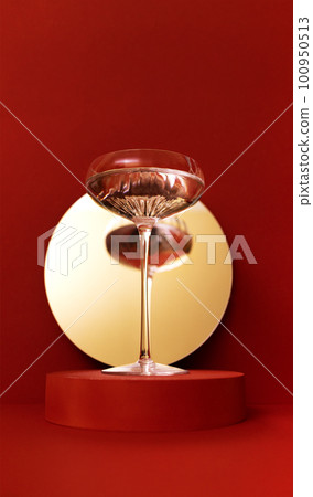 Retro glass of sparkling champagne is reflected in the mirror. Holliday concept Retro glass of sparkling champagne is reflected in the mirror. Holliday concept 100950513