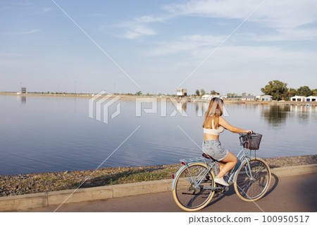 Young and positive girl in casual cloth has a fun. Young and positive girl in casual cloth has a fun. 100950517