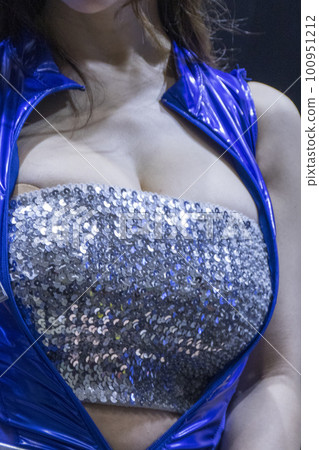 The breasts of a busty sister in a blue costume 100951212