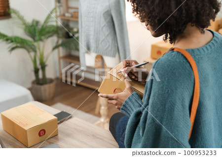 Young attractive woman owner startup business work happy with box at home prepare parcel delivery in sme supply chain, online delivery idea concept Young attractive woman owner startup business work happy with box at home prepare parcel delivery in sme supply chain, online delivery idea concept 100953233