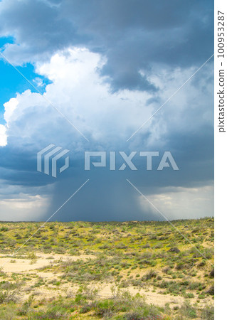 Thunderstorm unusual cloud over the Kyzylkum desert, rare rain over the desert area 100953287