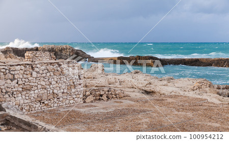 Coastal landscape with splashing waves at stormy Mediterranean Sea 100954212