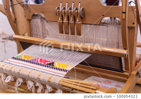 traditional wooden loom with unfinished work traditional wooden loom with unfinished work 100954321