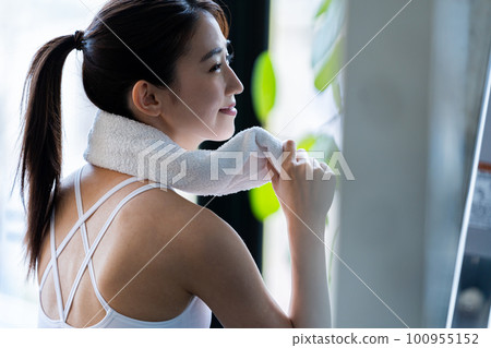Young woman training in a sports gym Young woman training in a sports gym 100955152