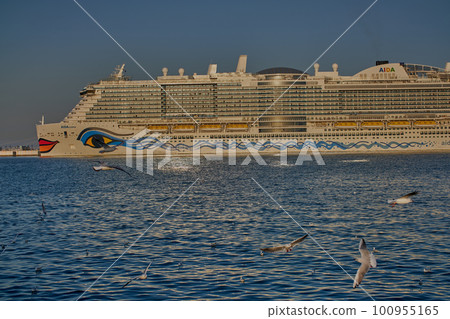 Old Doha port (Mina District) in Doha, Qatar afternoon shot showing cruise ship ( AIDA cosma) . Old Doha port (Mina District) in Doha, Qatar afternoon shot showing cruise ship ( AIDA cosma) . 100955165