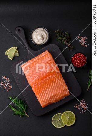 Fresh tasty raw red fish fillet with spices and herbs 100956081