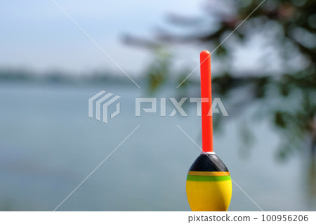 Fishing concept. Bobber on the background of the river close-up 100956206