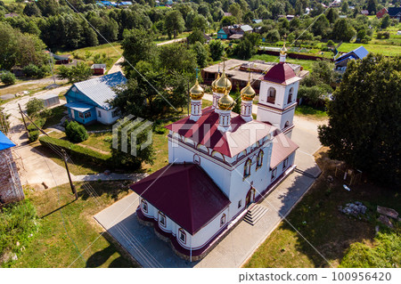 Aerial view of the Church of the Resurrection of the 17th century in the village of Trubino, Kaluzhskiy region, Russia 100956420
