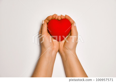 hands holding red heart, health care, love, organ donation, praying concept hands holding red heart, health care, love, organ donation, praying concept 100957571