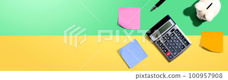 Calculator with a piggy bank 100957908