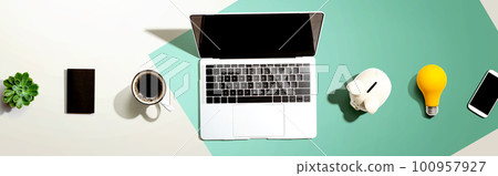 Laptop computer with a piggy bank 100957927