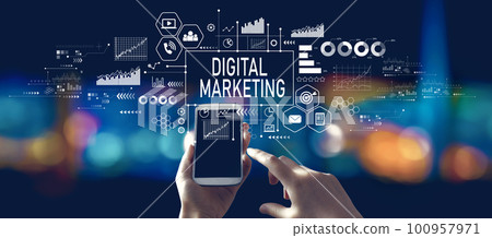 Digital marketing with person using a smartphone at night Digital marketing with person using a smartphone at night 100957971