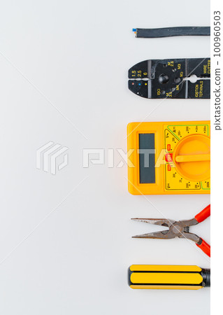 Stripper, Pliers, Multimeter, Wire and Screwdriver on a white background Stripper, Pliers, Multimeter, Wire and Screwdriver on a white background 100960503